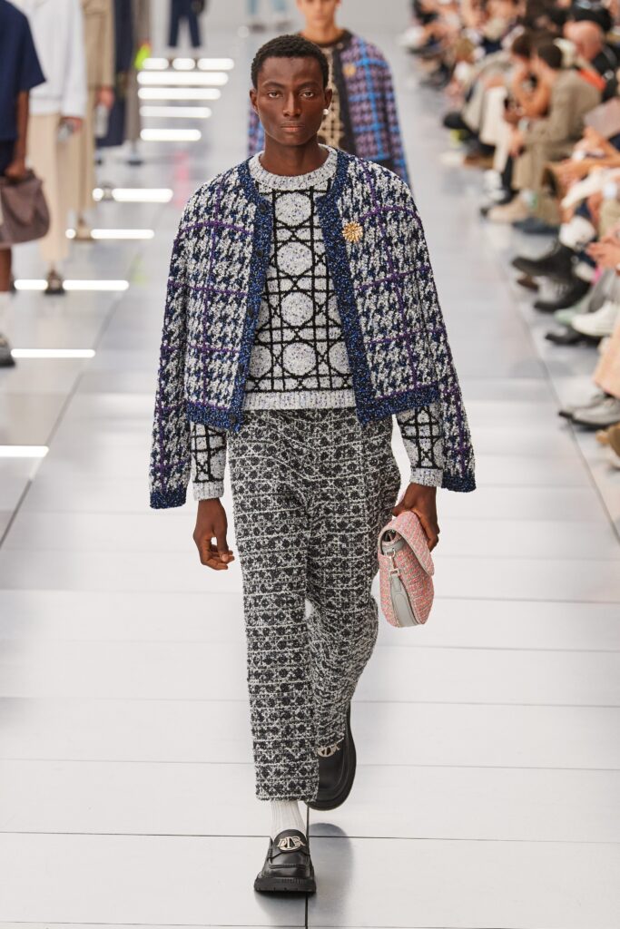 A relaxed fit jacket with a printed design paired with matching printed pants.