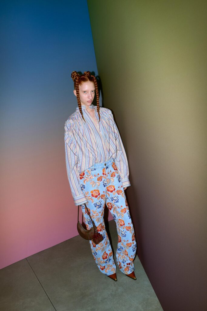 A relaxed blue and white striped shirt paired with floral pants, featuring a collared design.