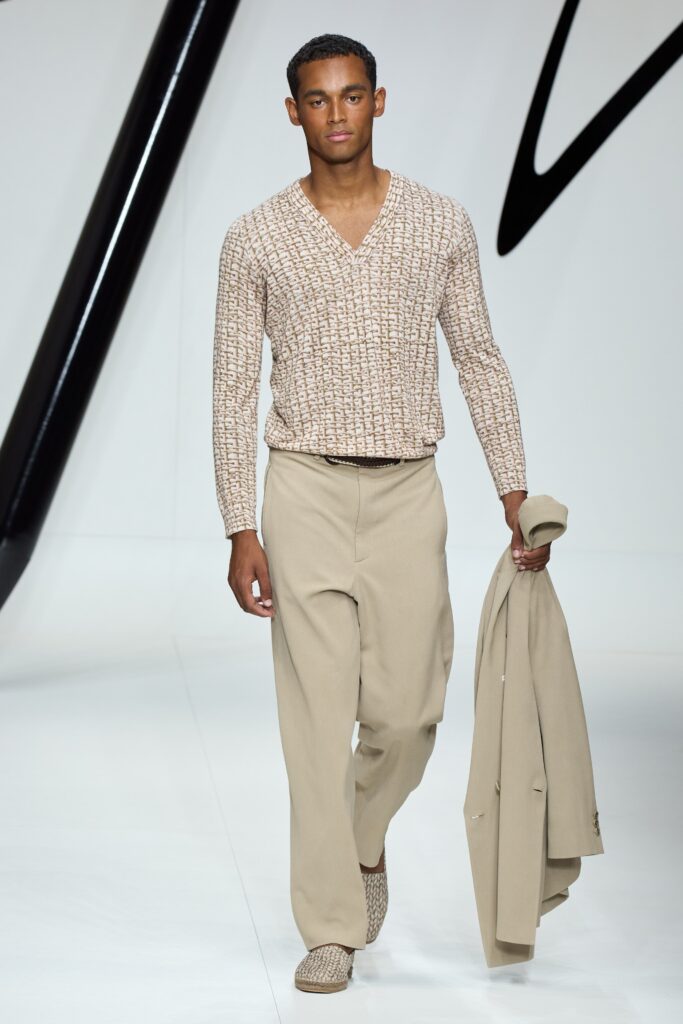 A relaxed beige printed long-sleeve shirt paired with matching relaxed pants.