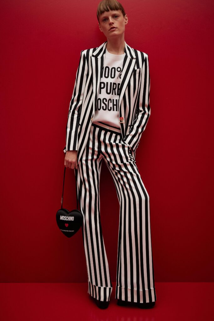 A fitted black and white striped suit with a collared long-sleeve shirt.