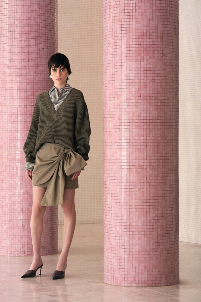 green ribbed top and beige skirt