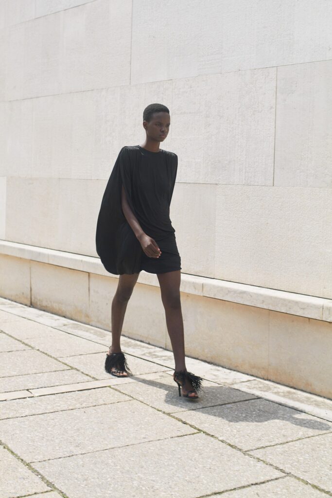 black silk mini dress with fringed shoes