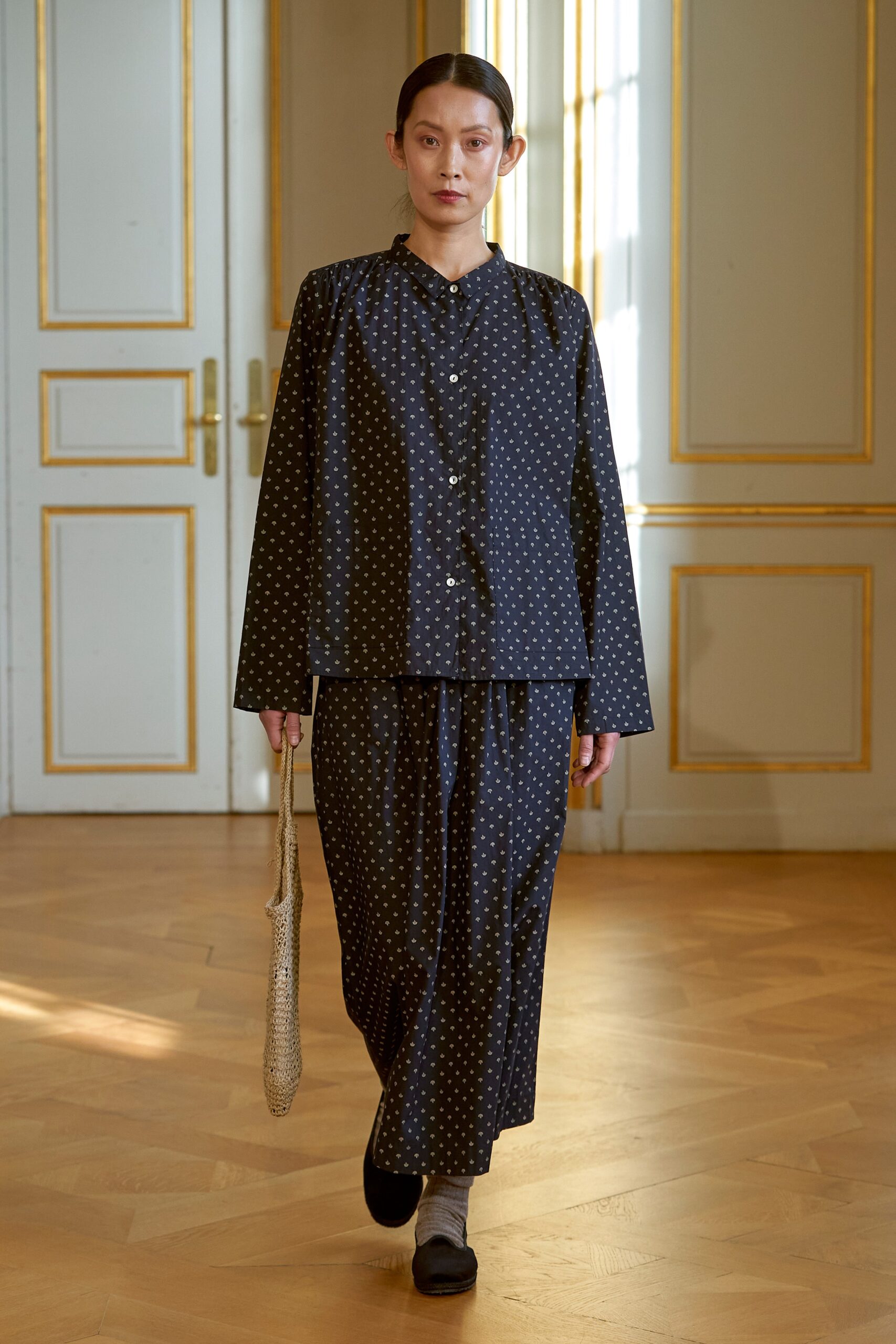 black polka-dot silk shirt and pants