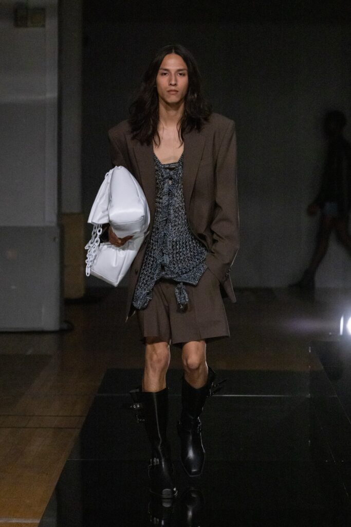 An oversized brown blazer paired with matching shorts, featuring a layered design.