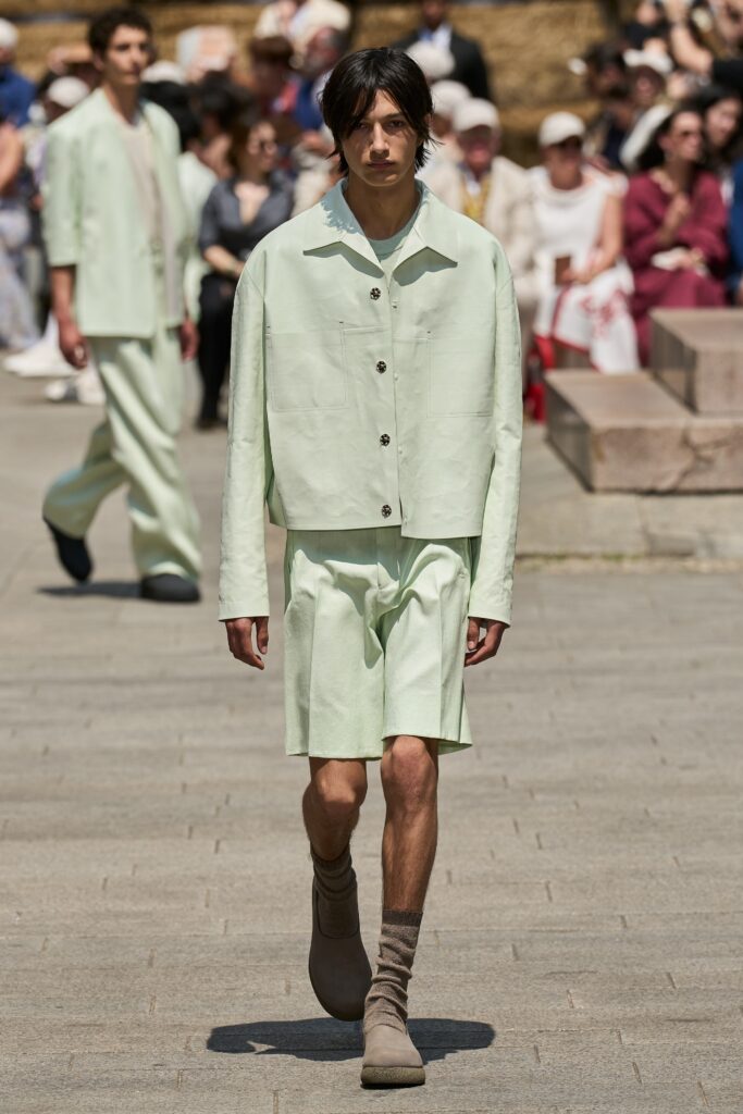 A relaxed green cotton jacket with a collared neckline paired with matching shorts.