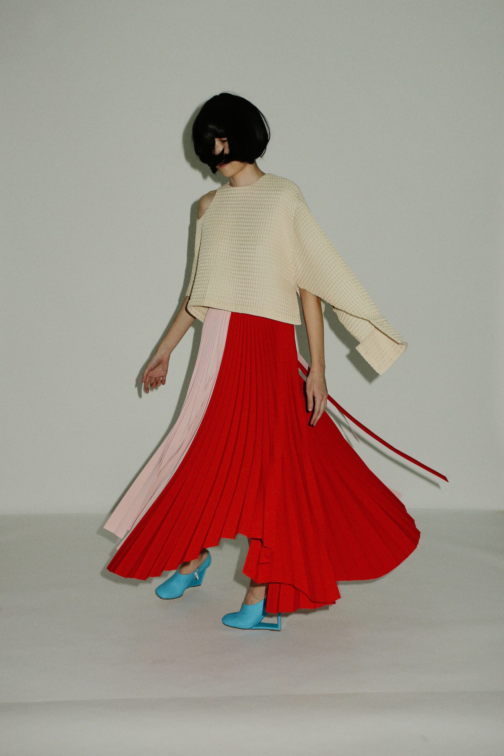 red silk long-sleeve fitted pleated flowing maxi skirt