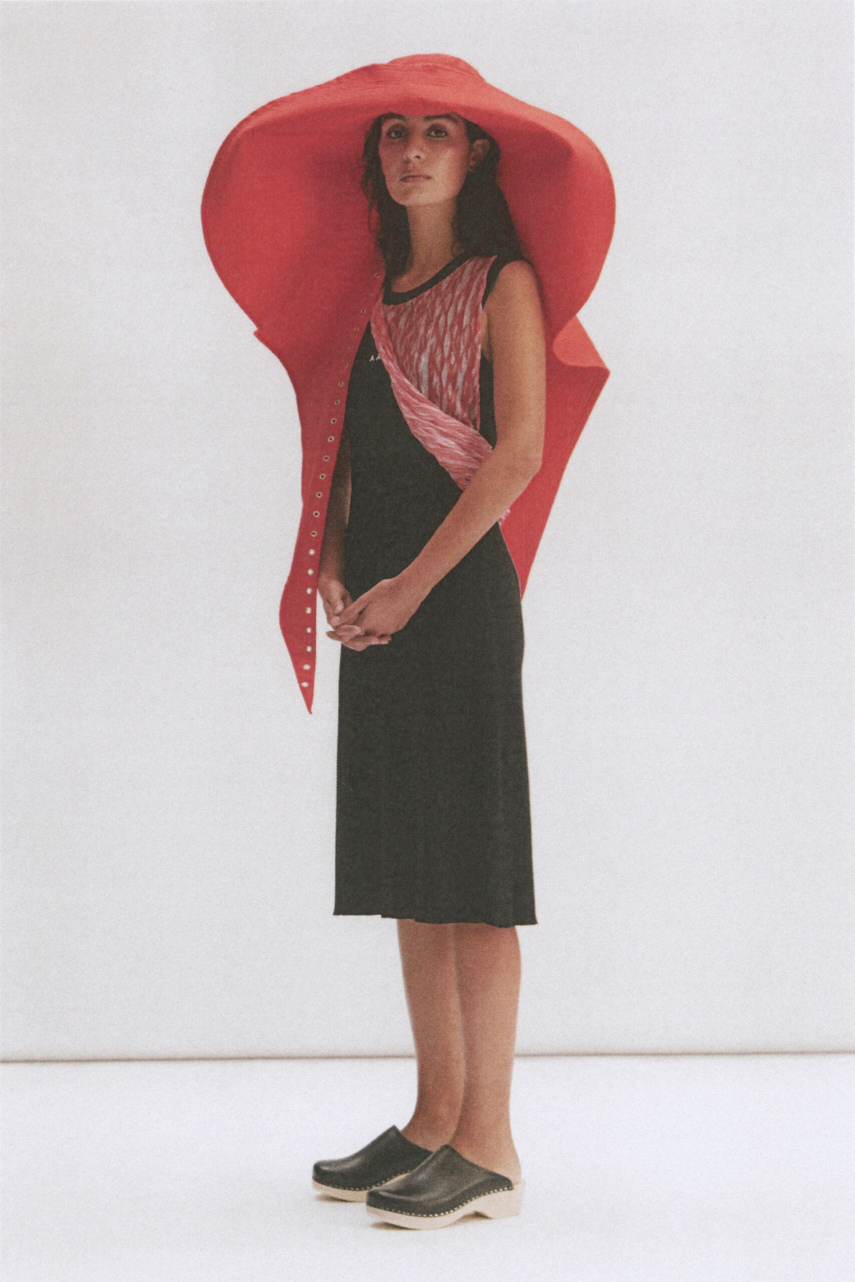 red vinyl long-sleeve structured buttoned cape