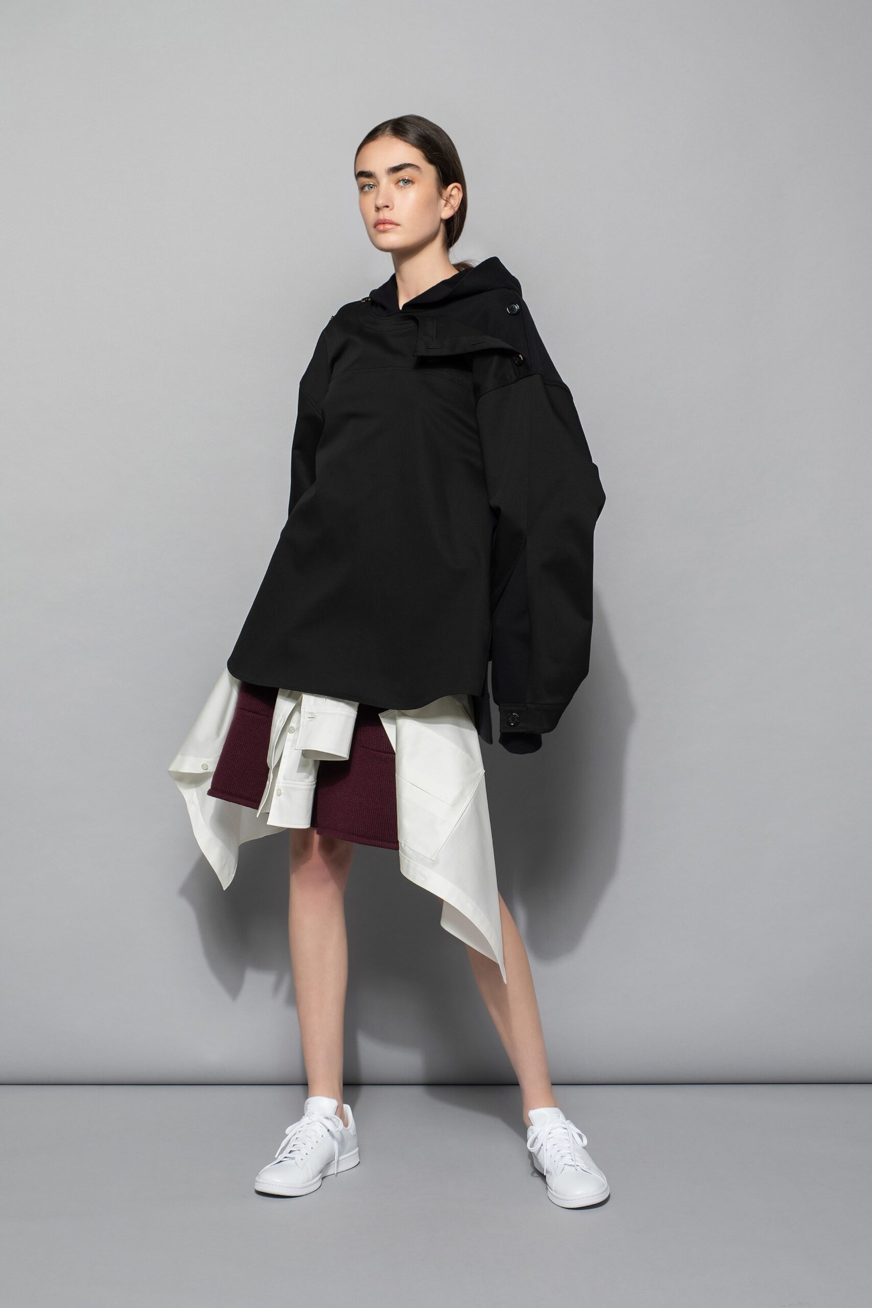 black oversized jacket and asymmetric skirt