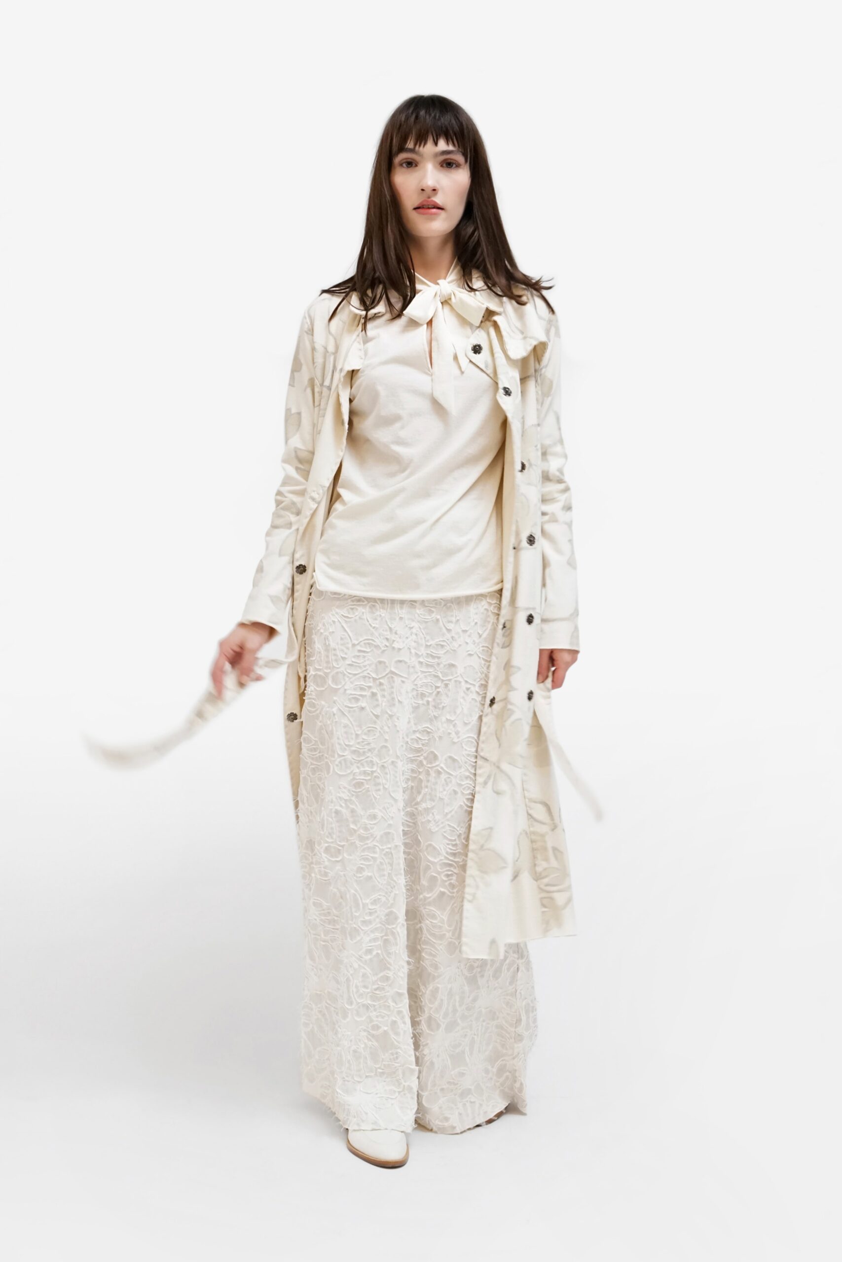 white trench coat with lace skirt