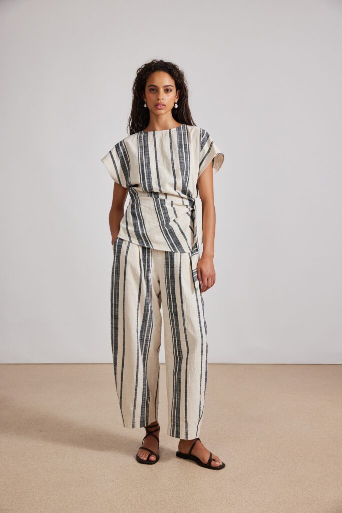 A relaxed beige striped top paired with matching relaxed pants for a casual look.