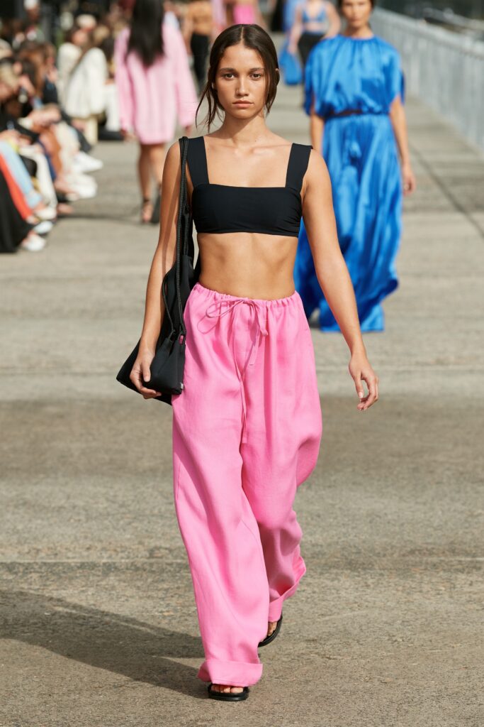 black fitted top and pink relaxed pants