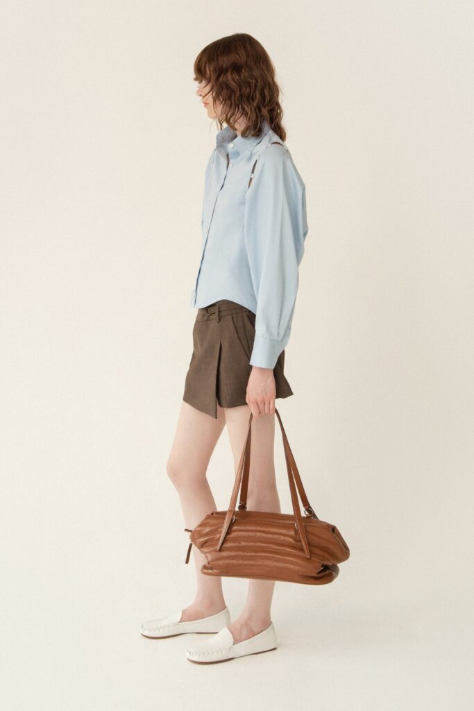 blue cotton shirt and brown shorts