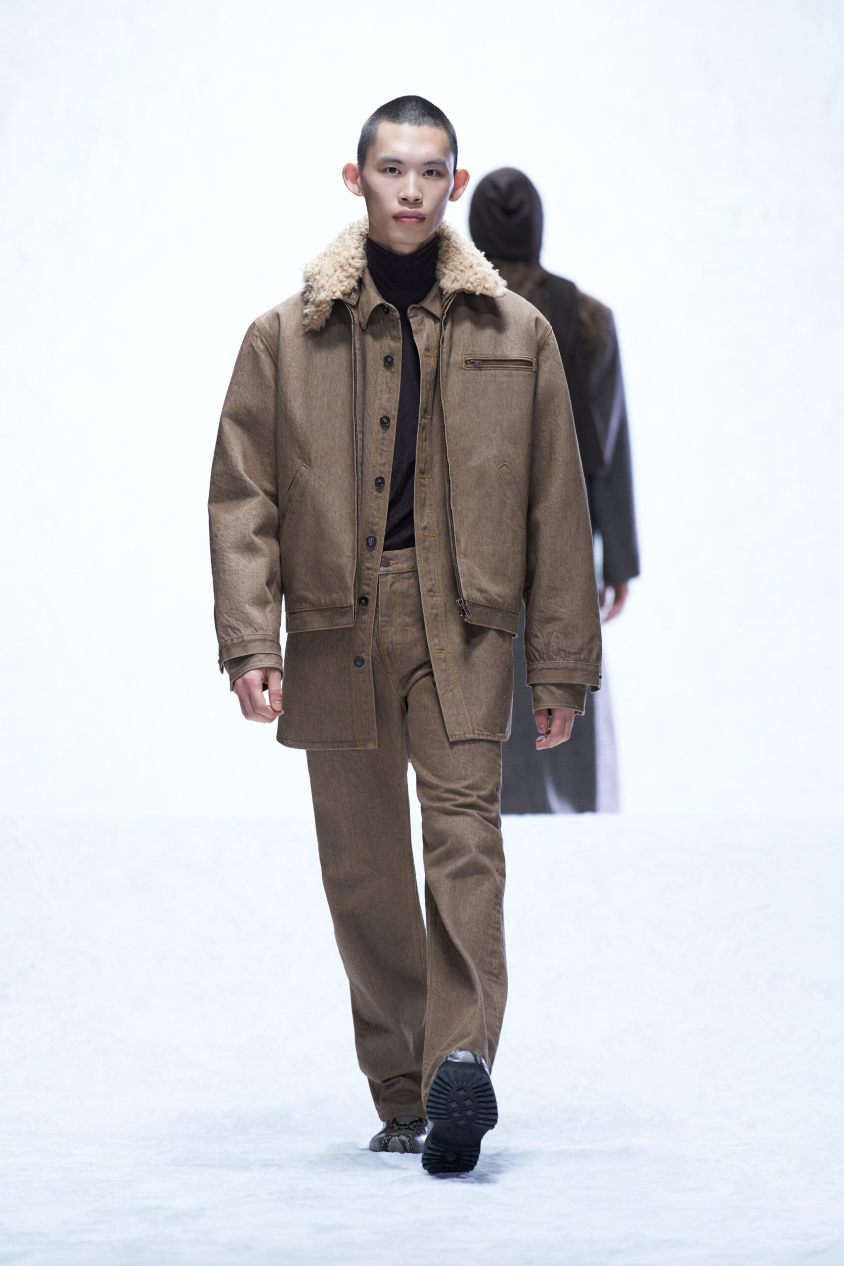 A relaxed brown denim jacket with a collared neckline paired with matching pants.