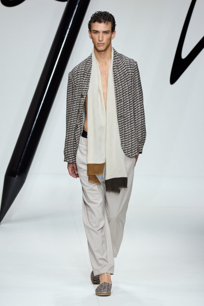 A relaxed beige checked jacket paired with beige pants for a stylish look.