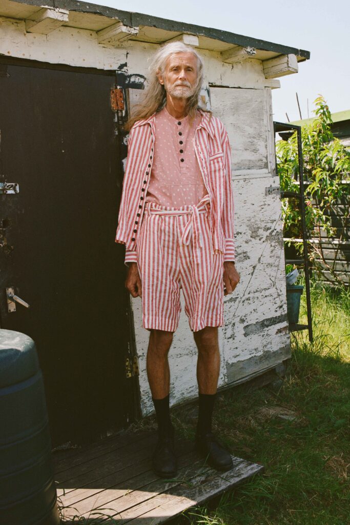 A relaxed fit red and white striped shirt paired with matching shorts.