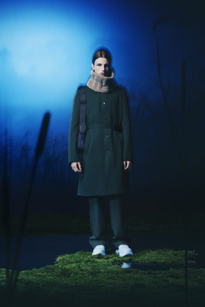 A relaxed green wool coat with a collared neckline paired with matching pants.
