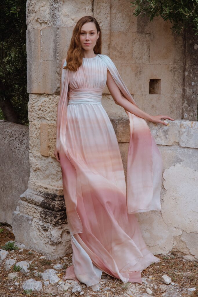 A relaxed pink and blue silk sleeveless dress with a high neckline and layered design.