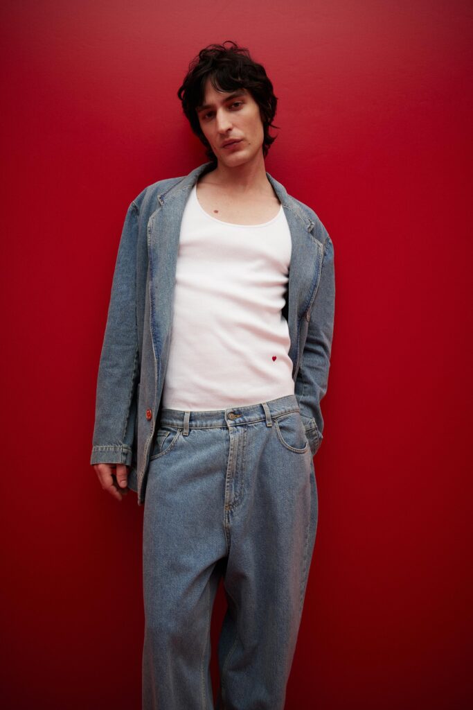 A relaxed fit blue denim jacket paired with matching relaxed denim pants.
