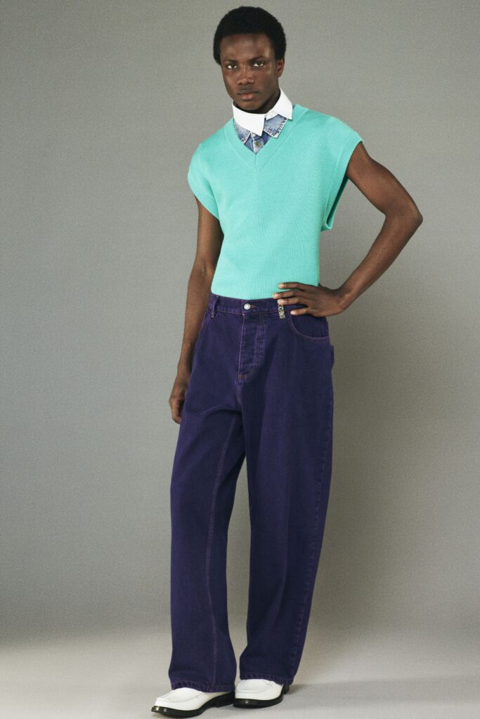 teal sleeveless top with purple pants