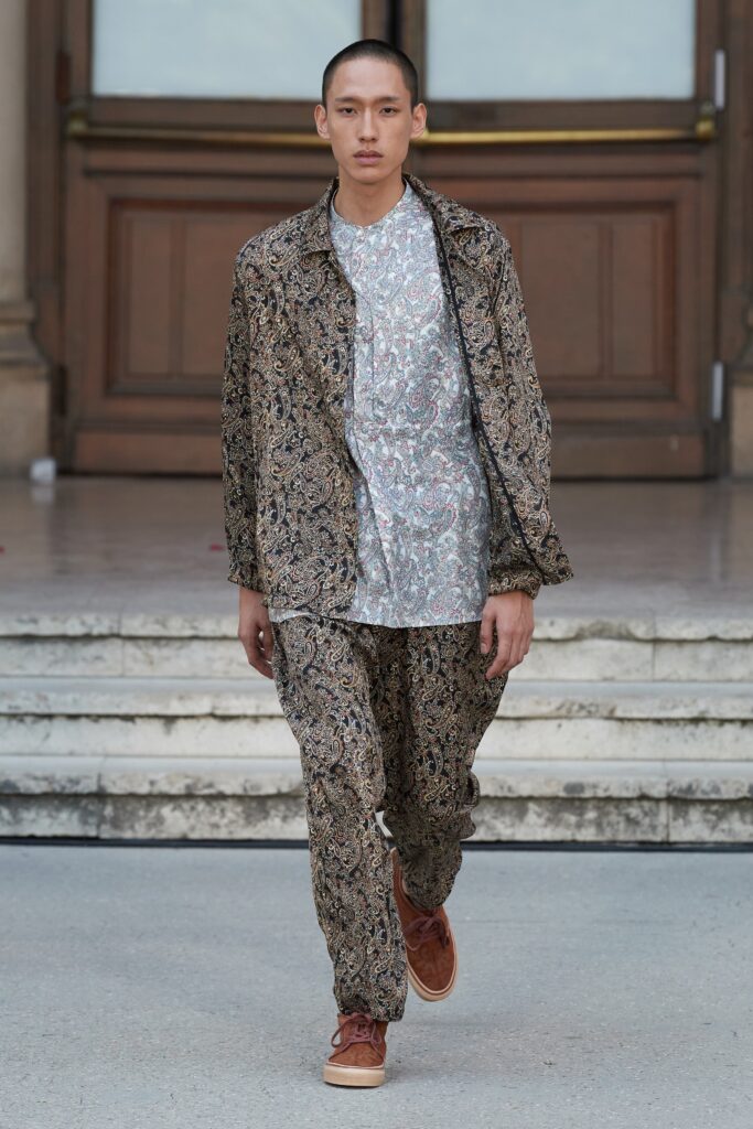 A relaxed fit multicolor printed jacket paired with matching pants, featuring a collared long-sleeve design.