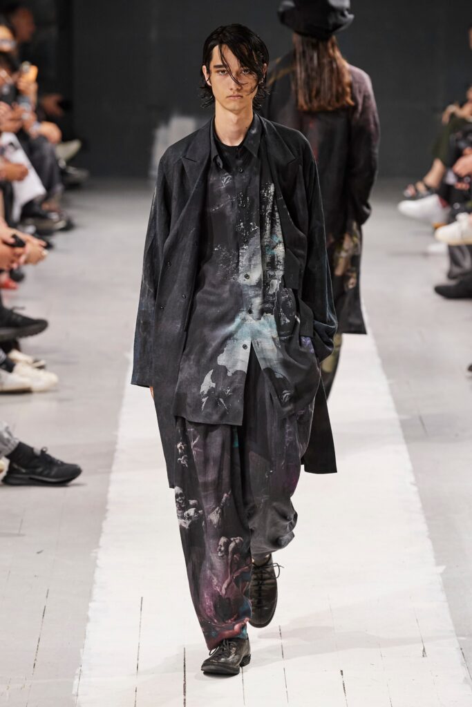 A relaxed black cotton jacket with long sleeves and printed pants for a contemporary look.