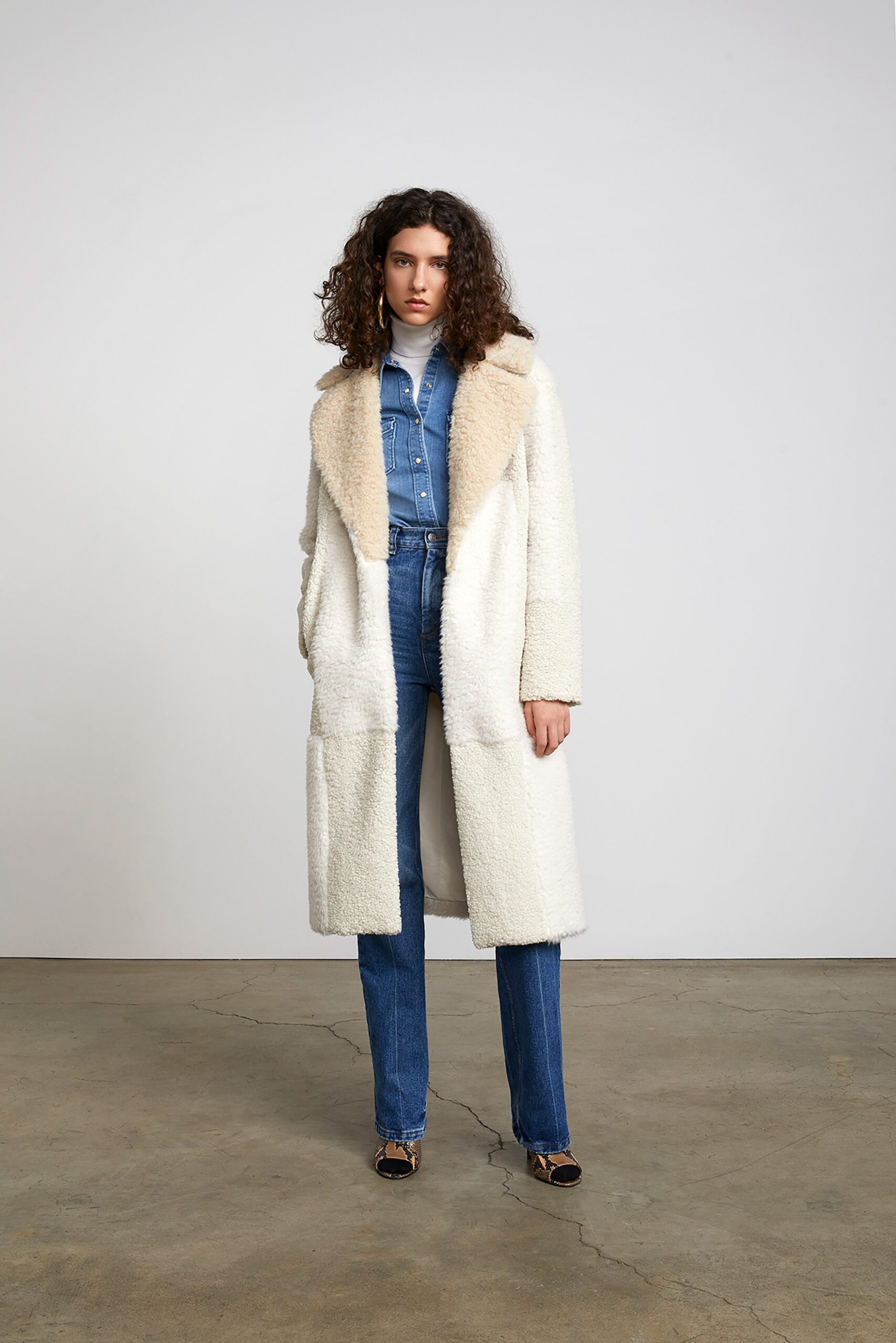 white faux-fur coat with denim