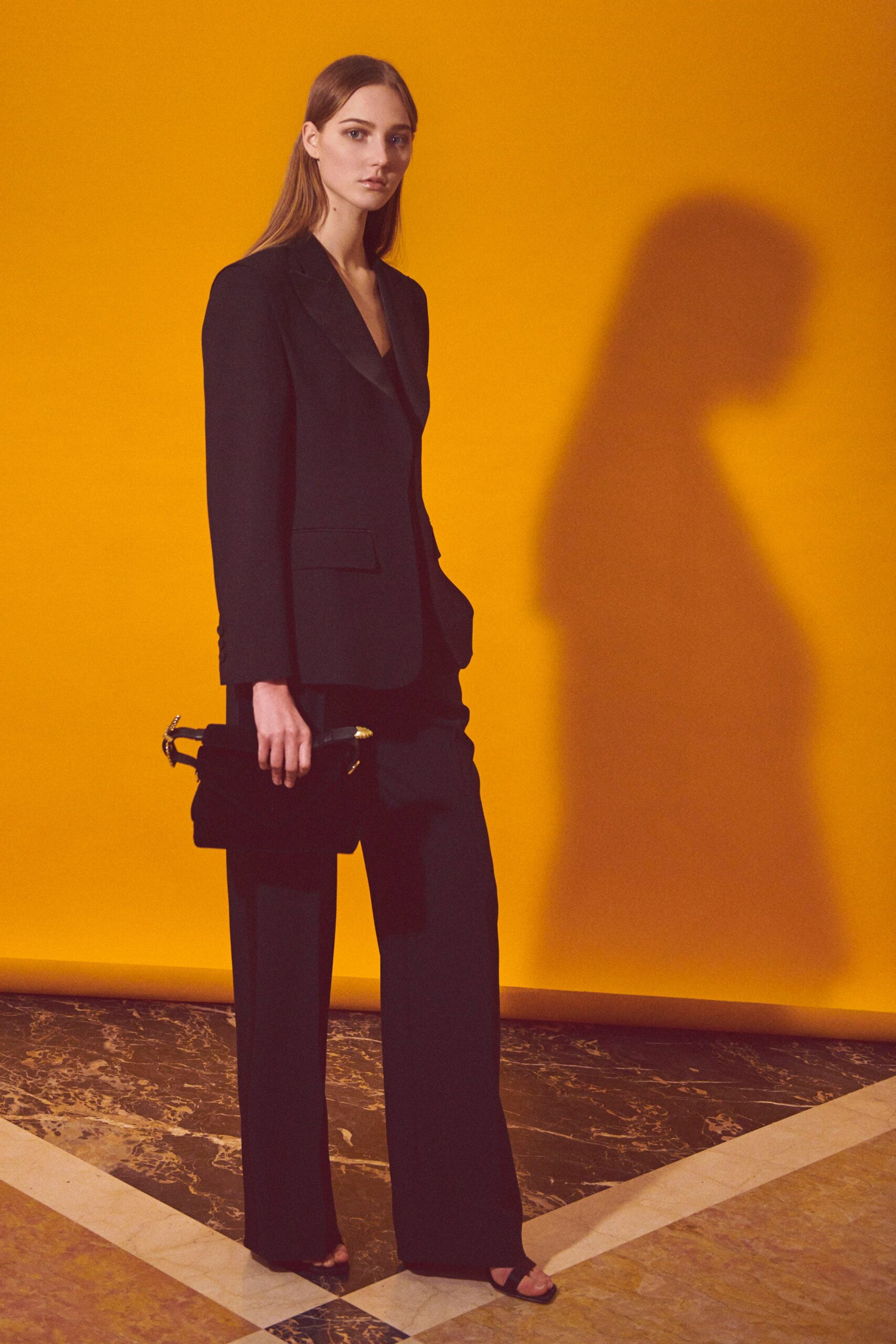 black tailored suit with bag