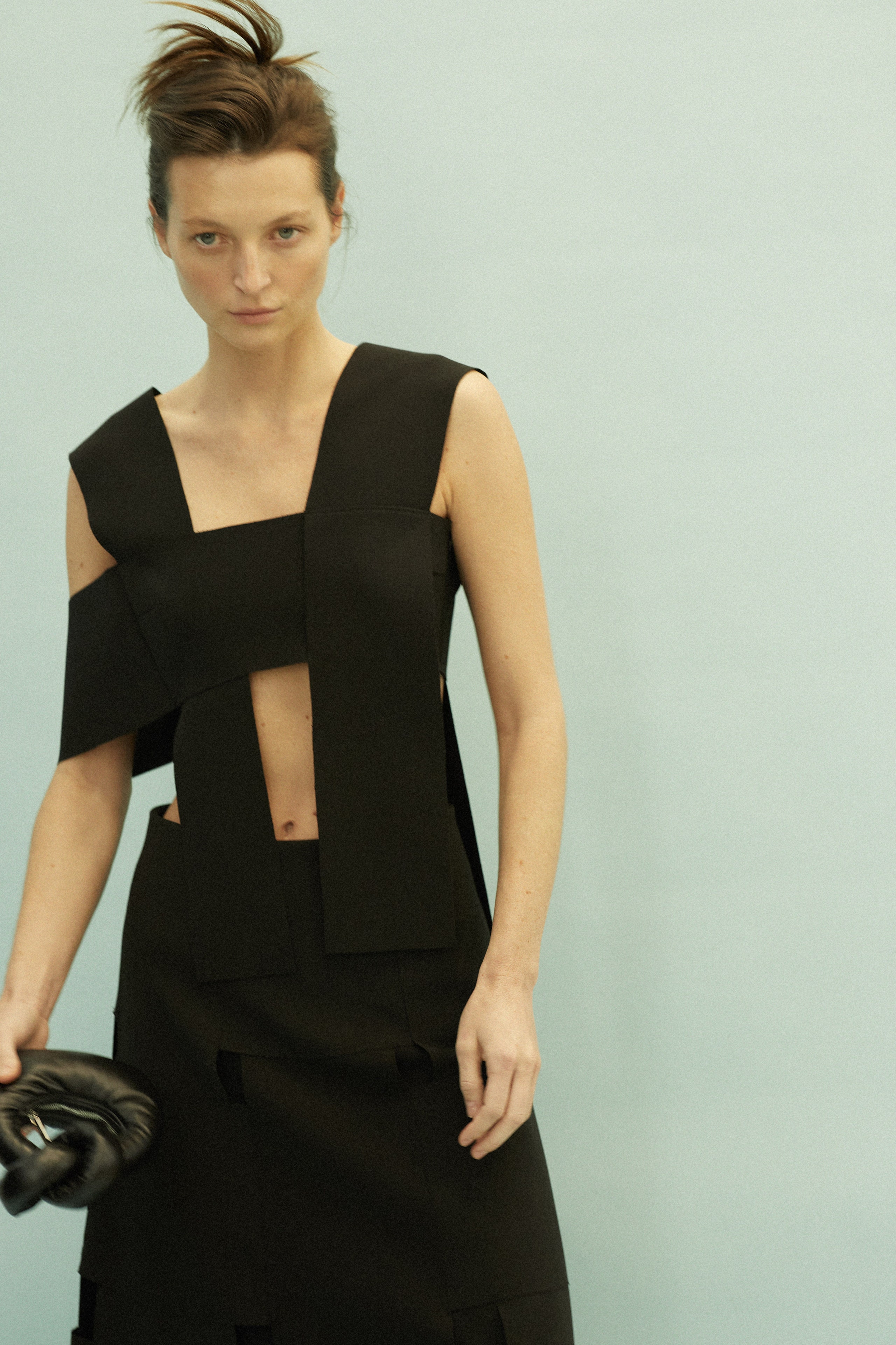 black structured sleeveless dress