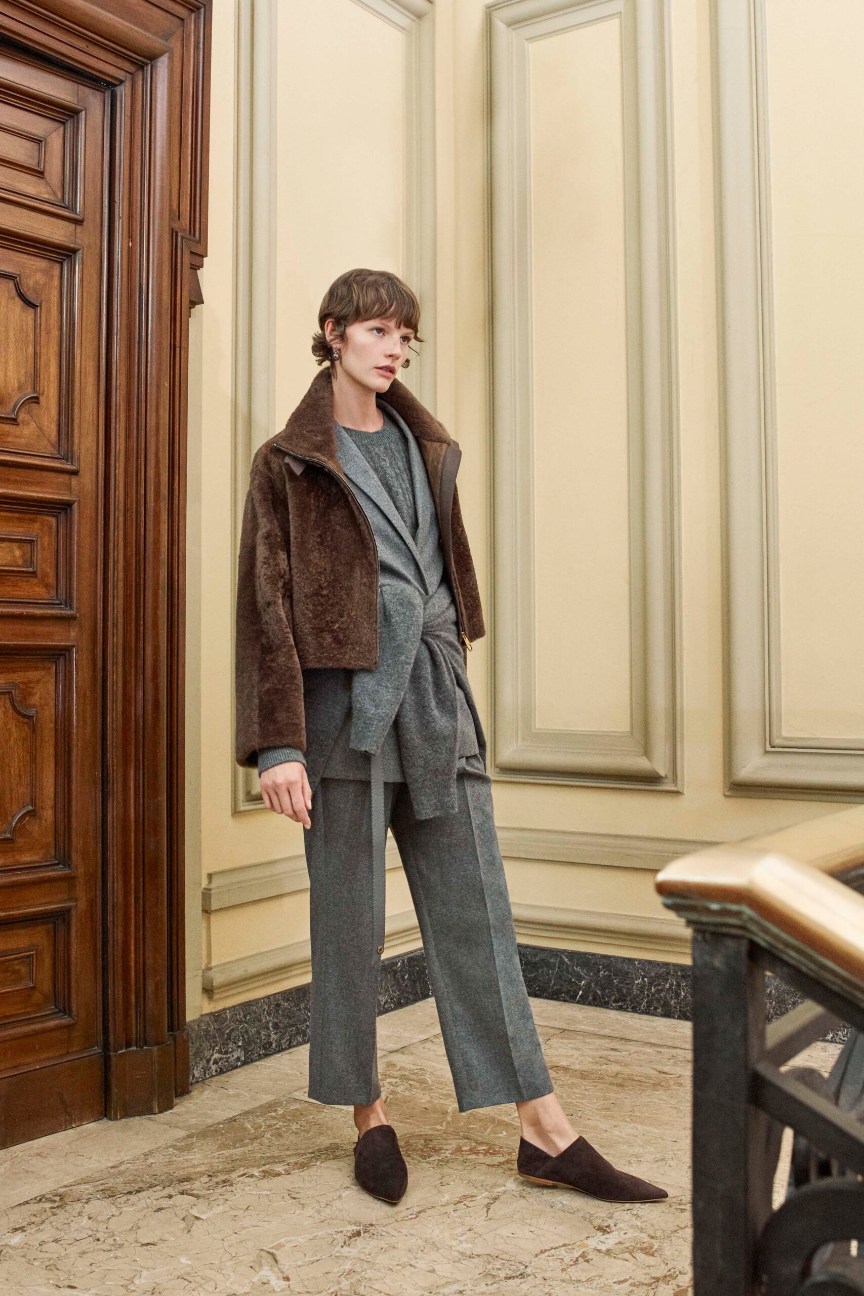 brown faux-fur jacket with gray top and tailored pants