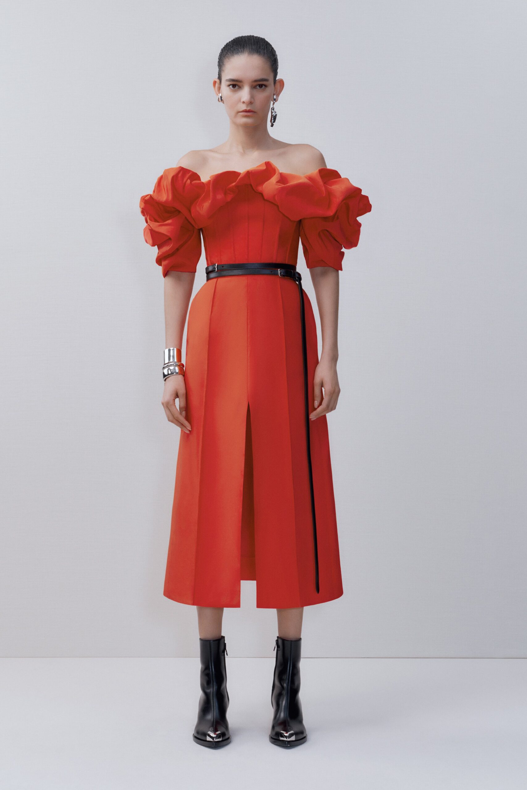 red off-shoulder midi dress with black boots