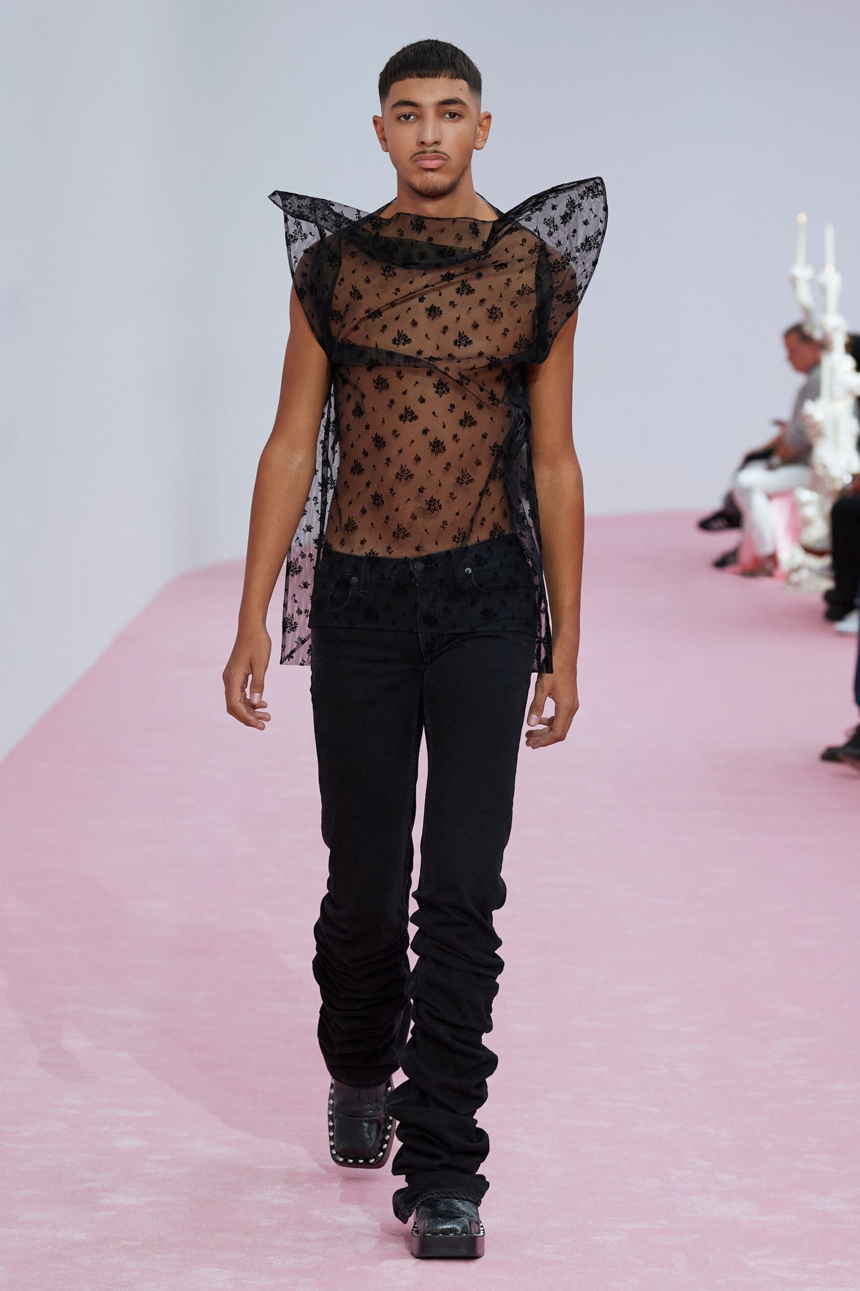 black mesh ruffled top and slim pants