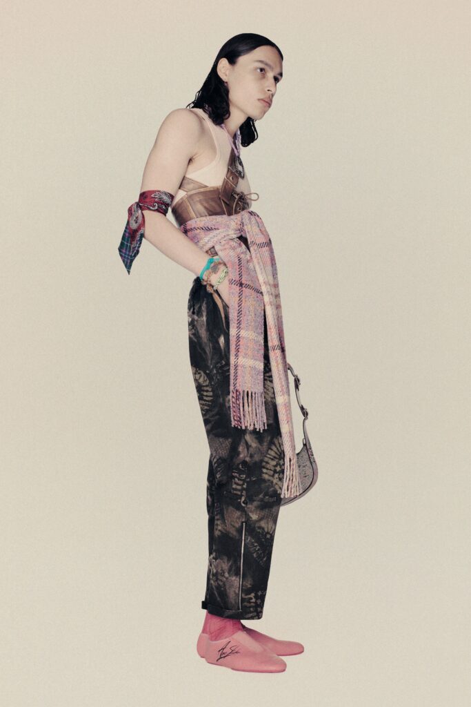 A relaxed outfit featuring brown printed pants and a sleeveless top.