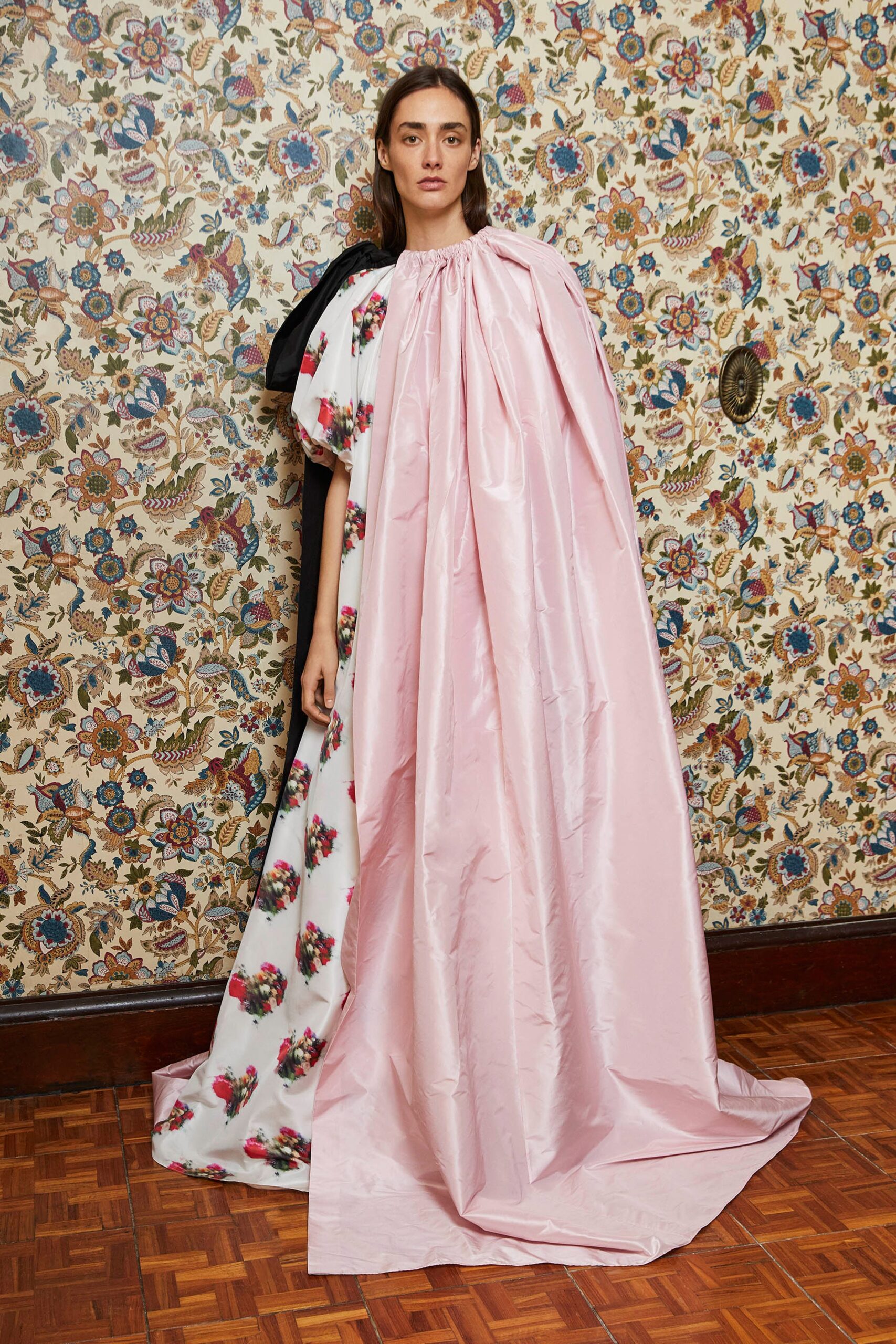 pink silk draped cape and white flared dress