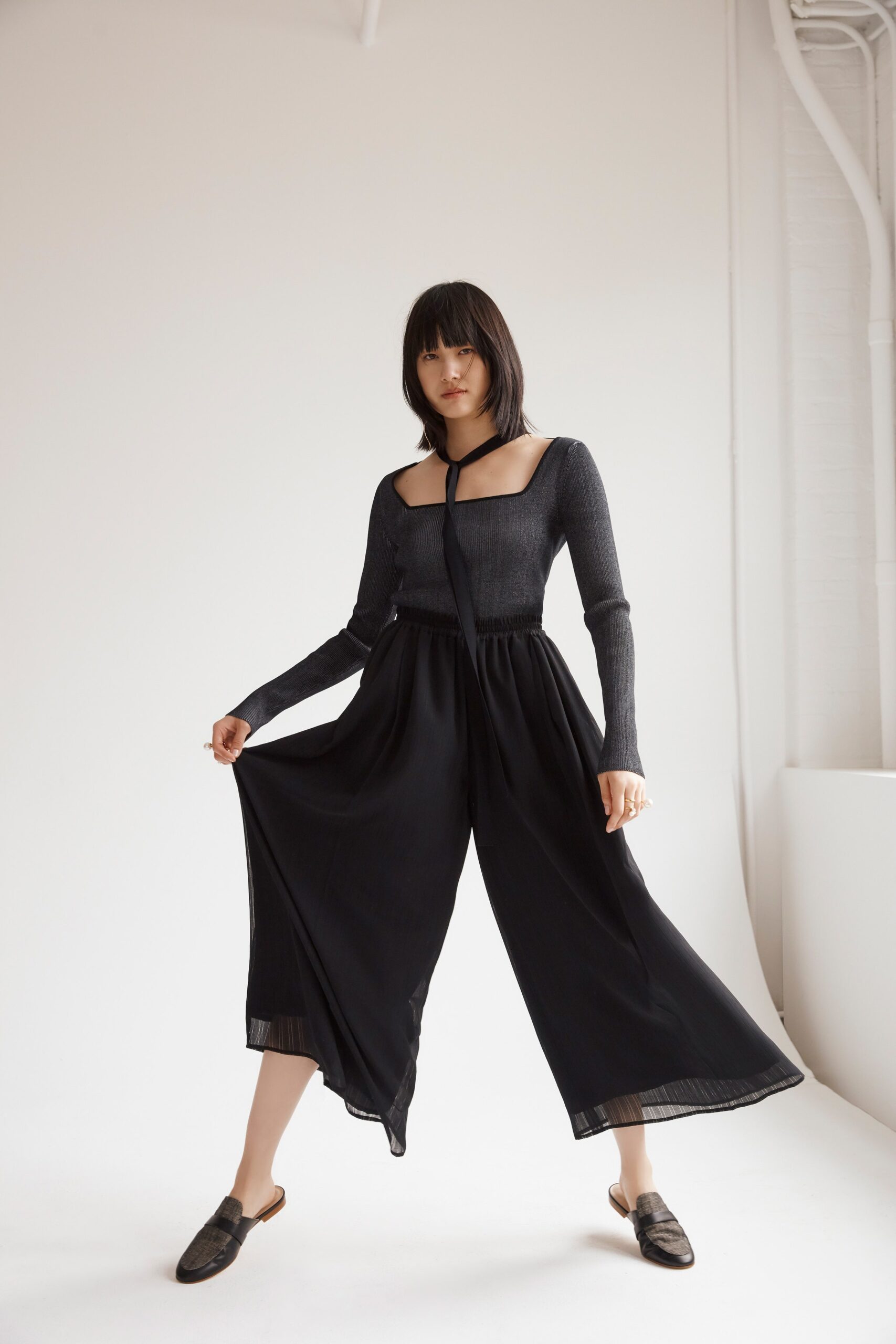 black fitted top with wide-leg pants