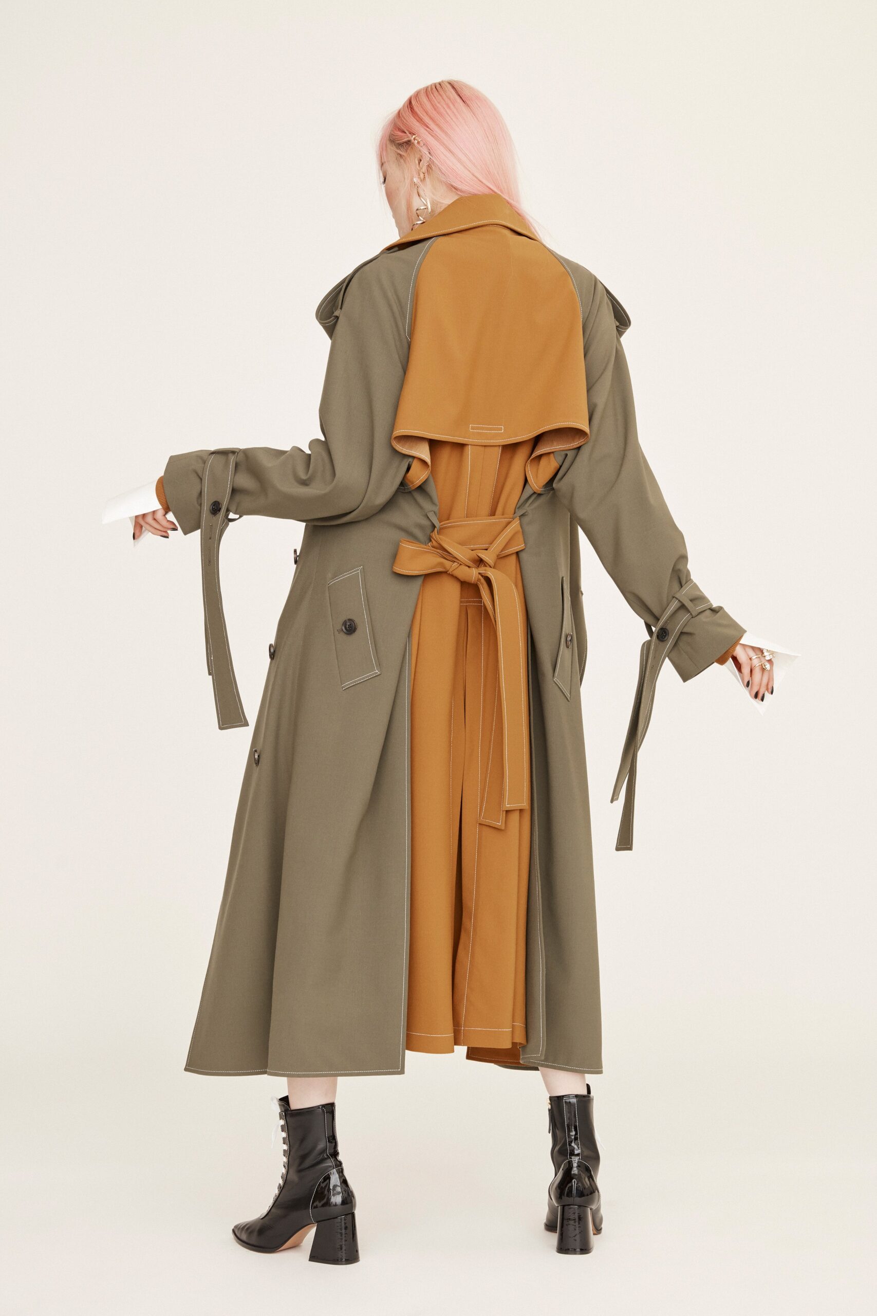 green trench coat with orange dress