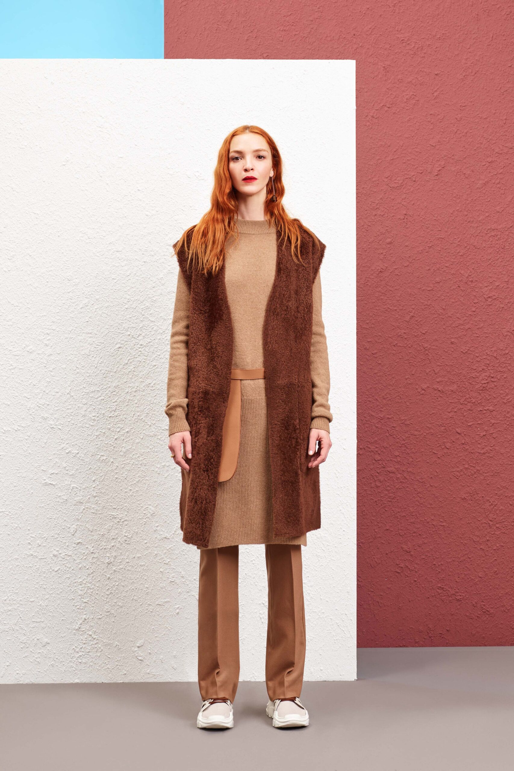 brown faux-fur vest with beige dress