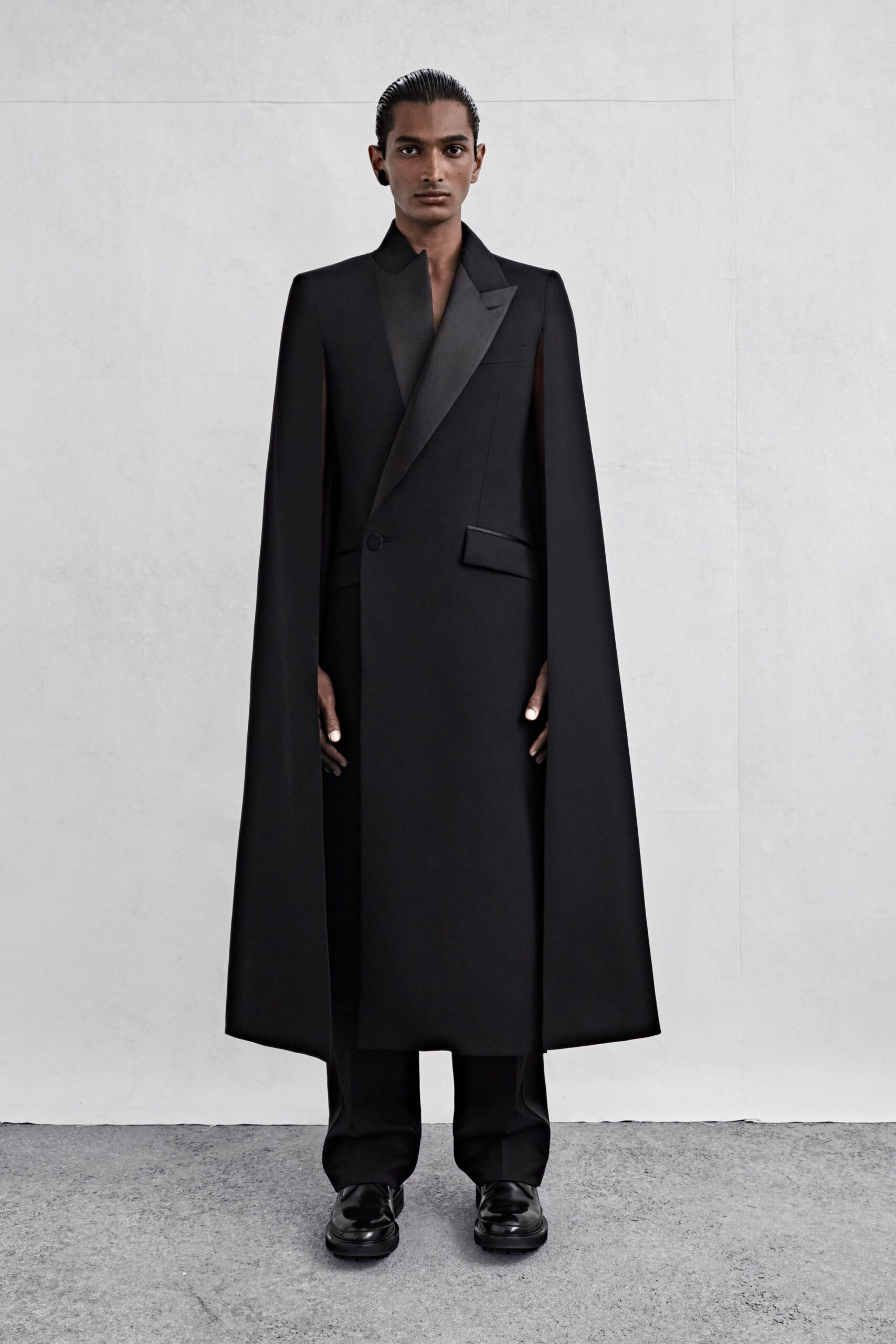 black wool long-sleeve collared structured buttoned cape