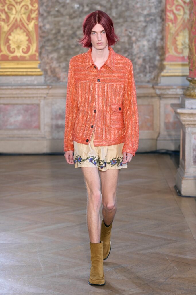 orange relaxed jacket with beige floral shorts