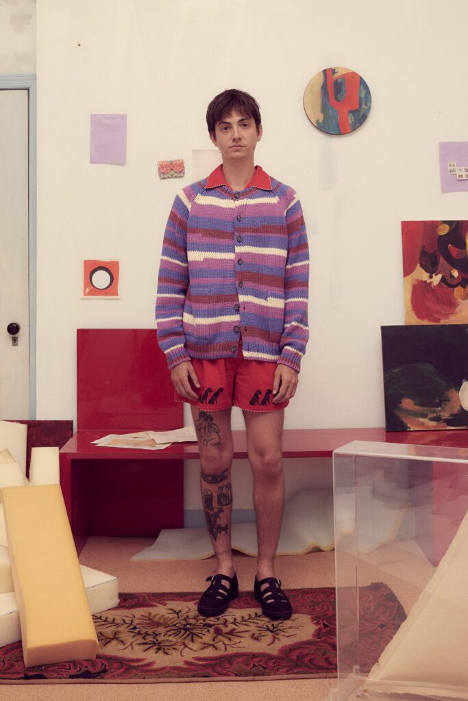 striped cardigan and red shorts