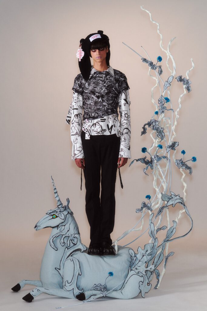 A relaxed black and white printed long-sleeve top paired with relaxed-fit pants.