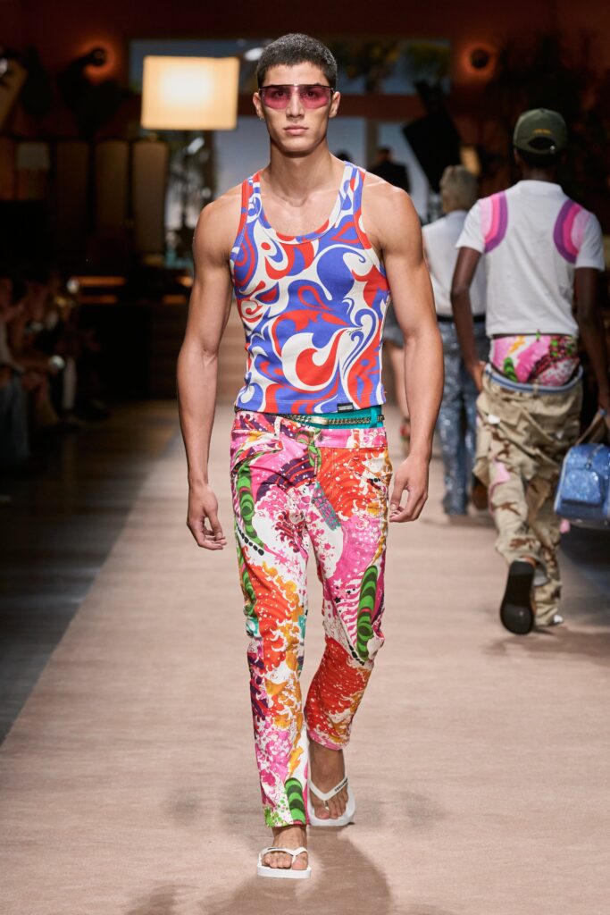 A fitted multicolor tank-top paired with vibrant printed pants, perfect for a bold fashion statement.