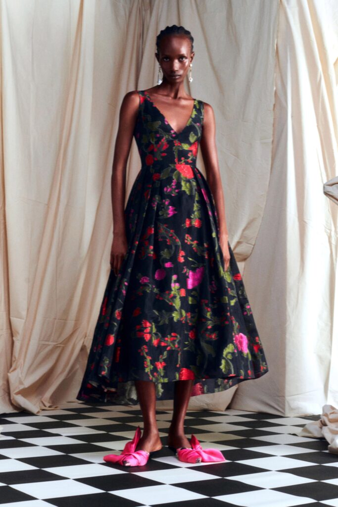 black floral midi dress with pink shoes