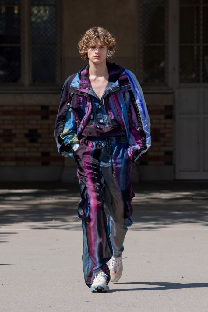 A relaxed multicolor silk jacket with long sleeves and matching pants, featuring a layered design.