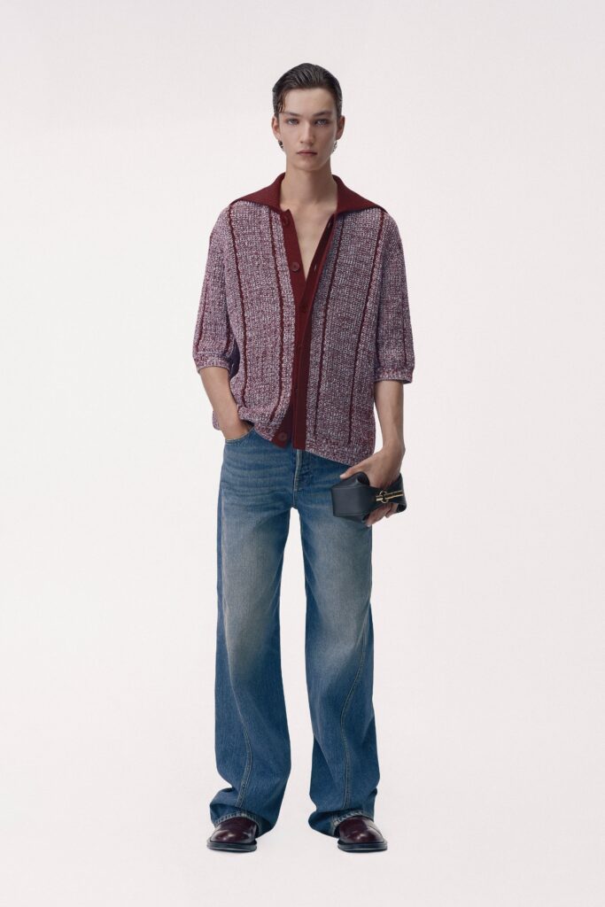 A relaxed red printed shirt paired with wide-leg blue denim jeans.