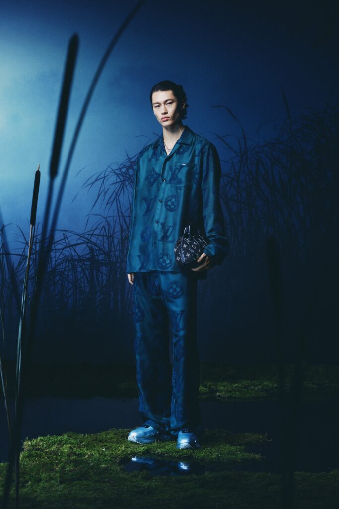 A relaxed blue cotton long-sleeve collared shirt paired with printed pants.