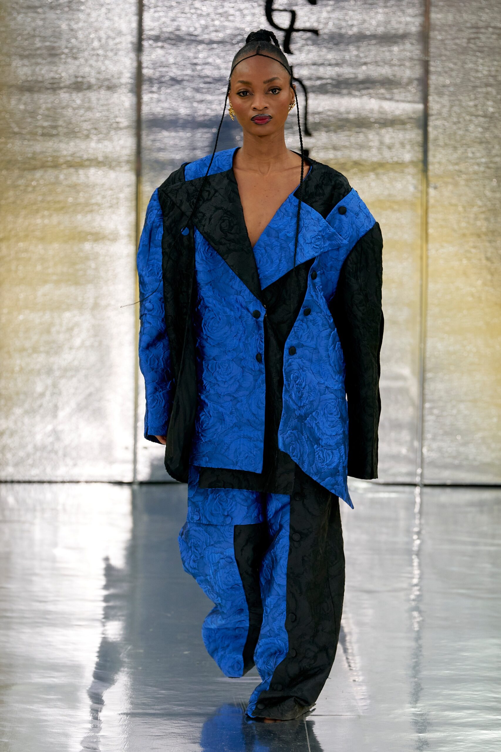 A relaxed fit blue and black printed jacket with long sleeves paired with matching pants.