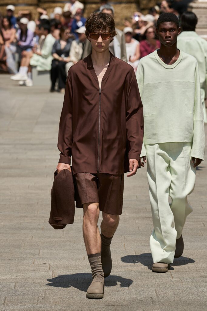 A relaxed brown cotton short-sleeve shirt paired with matching shorts, featuring a collared design.