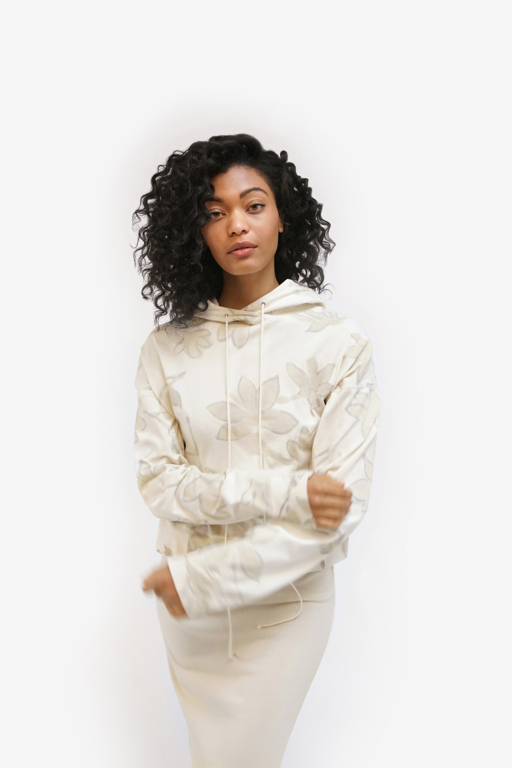 white printed hoodie and beige skirt