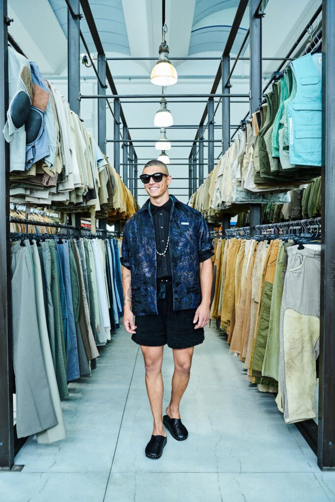 A relaxed black printed shirt paired with matching shorts for a casual look.