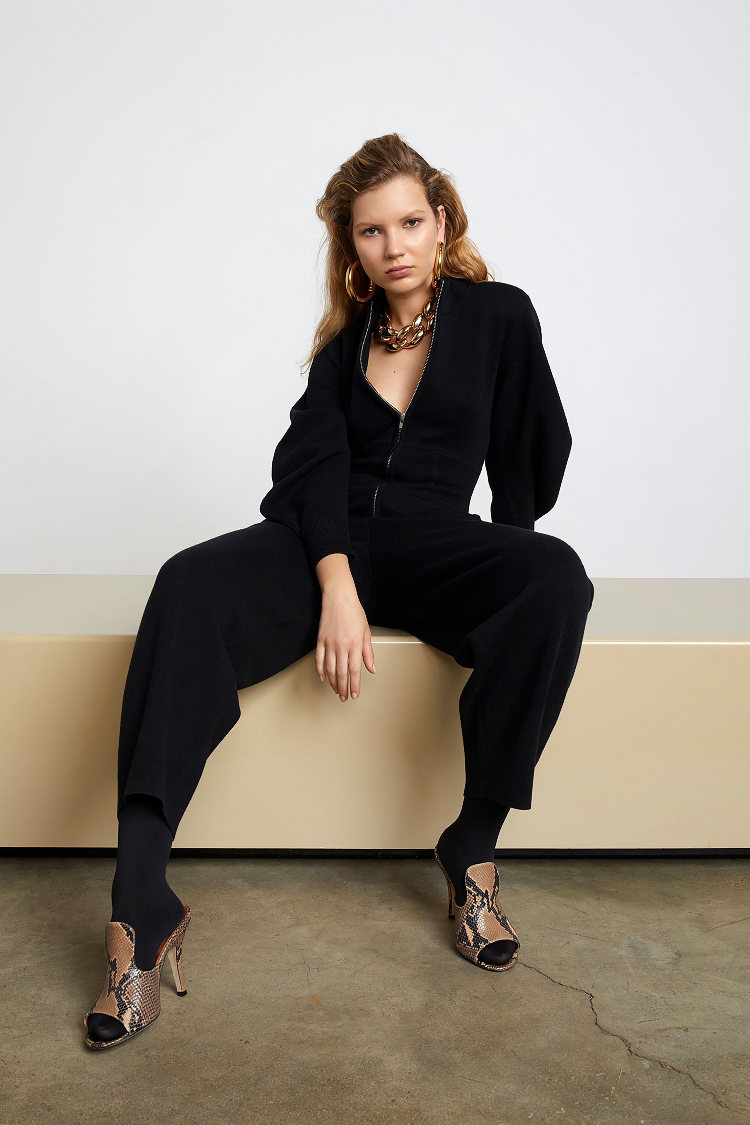 black fitted jumpsuit with multi shoes